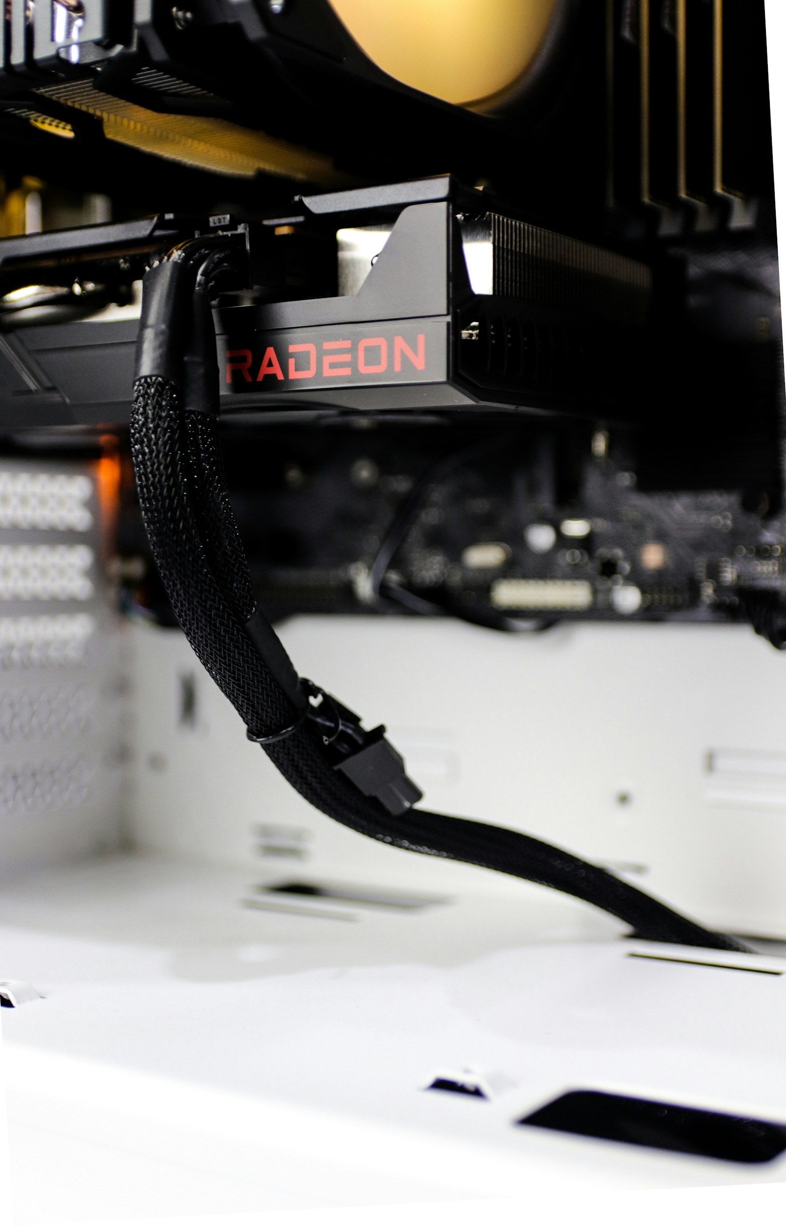 A close-up of a graphics card with cooling fans and aluminium fins.
