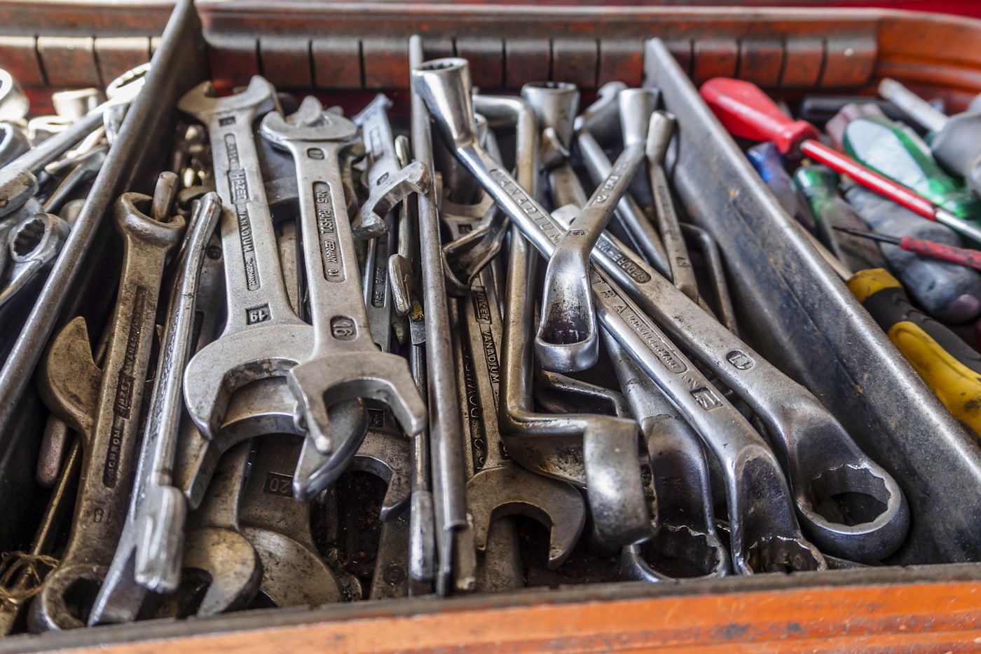 A toolbox filled with neatly organised wrenches and tools.