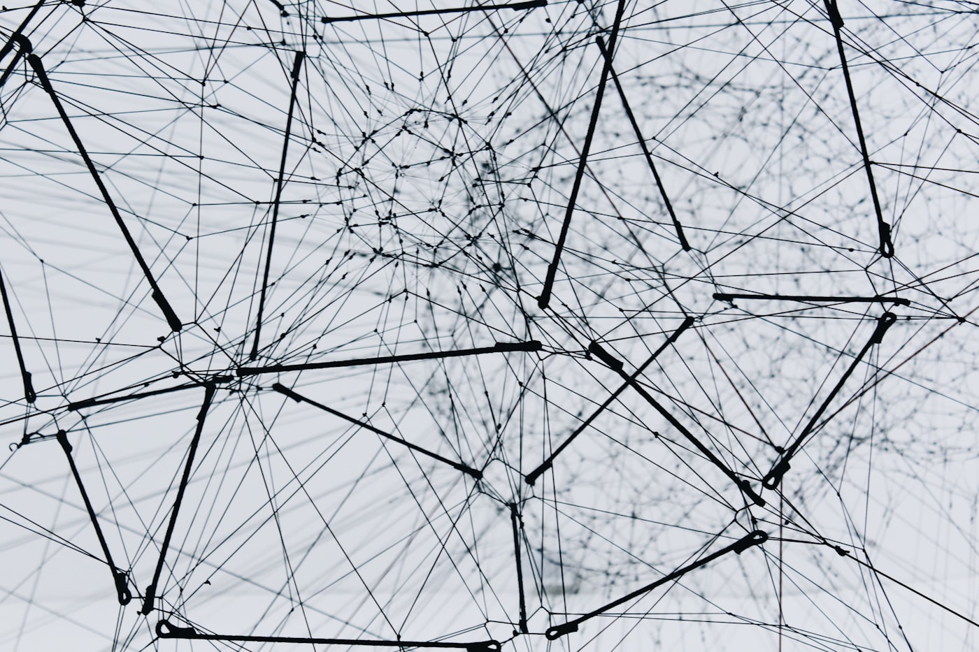 An art installation showing many spheres connected by lines, suggesting a network.